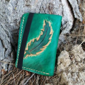 pluma turquesa cartera